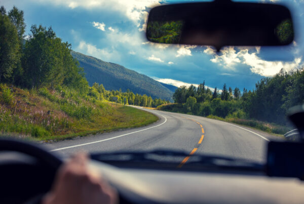 Driving a car on a mountain road. View from the windscreen of beautiful nature of Norway