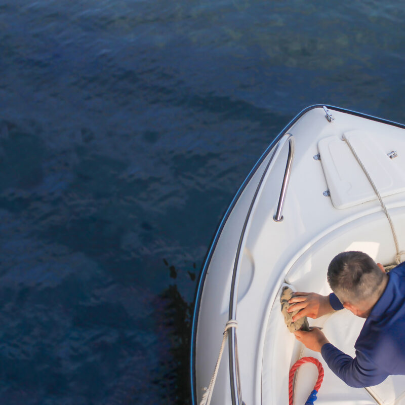 Sea fishing on a high-speed boat. Vacationers on a boat threw fishing rods into the sea in the evening at sunset.