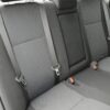 Close up image of clean backseat of car with fabric seats